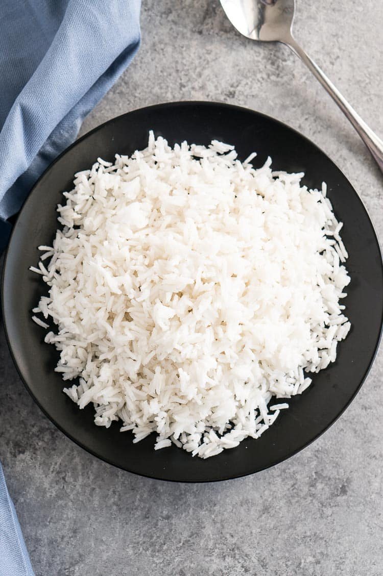 white rice served on a black plate