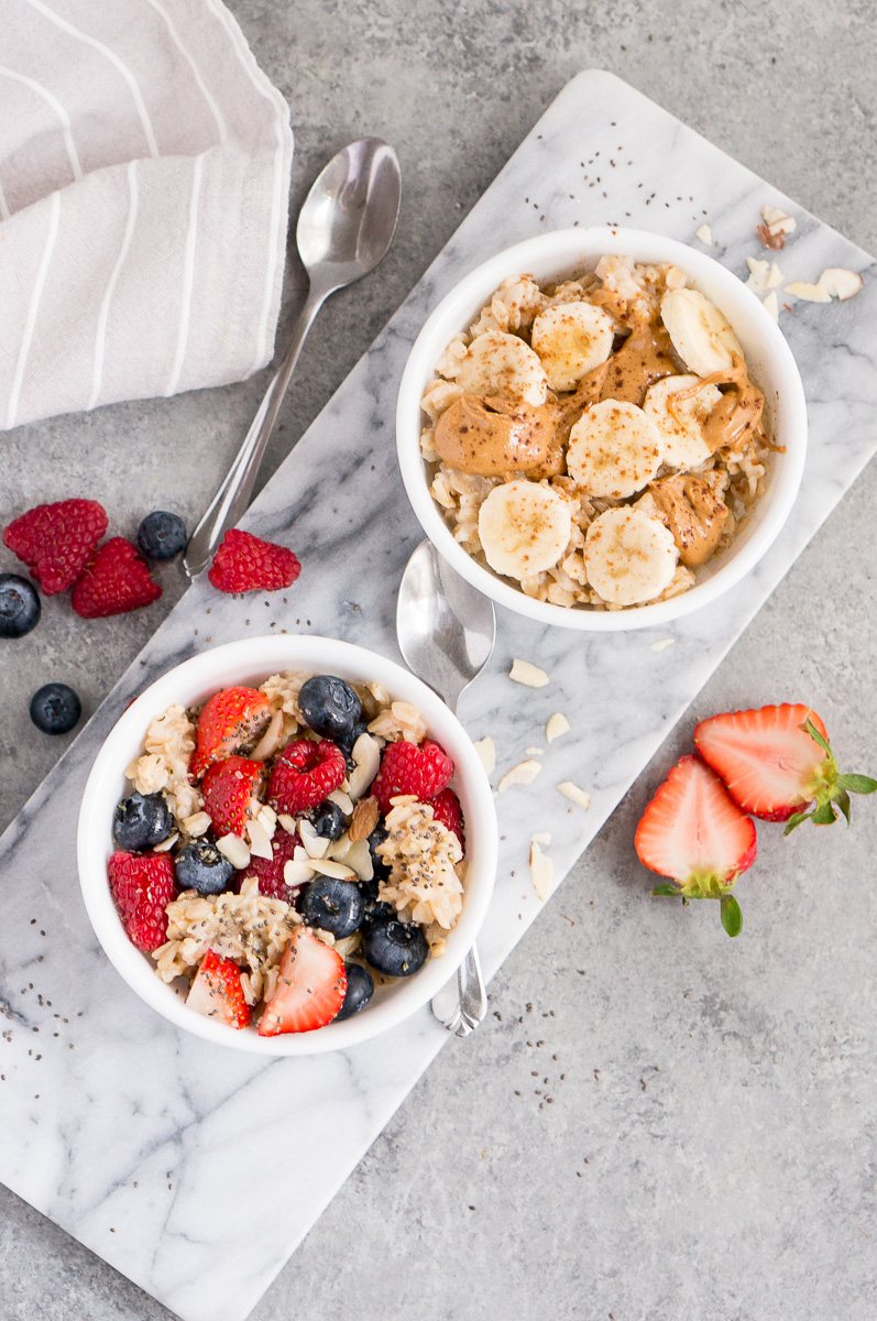 oatmeal topped with different fruit and nut toppings