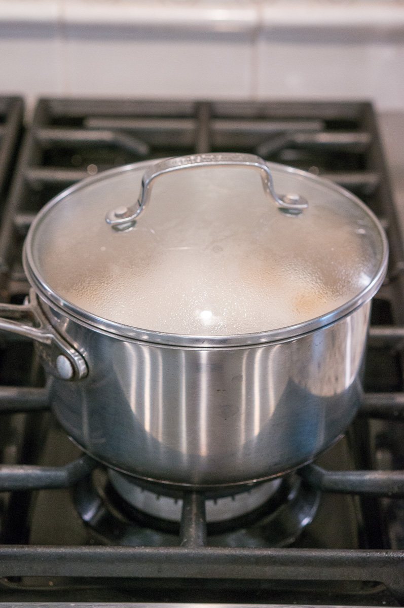 cooking old fashioned oatmeal on the stove in a pot