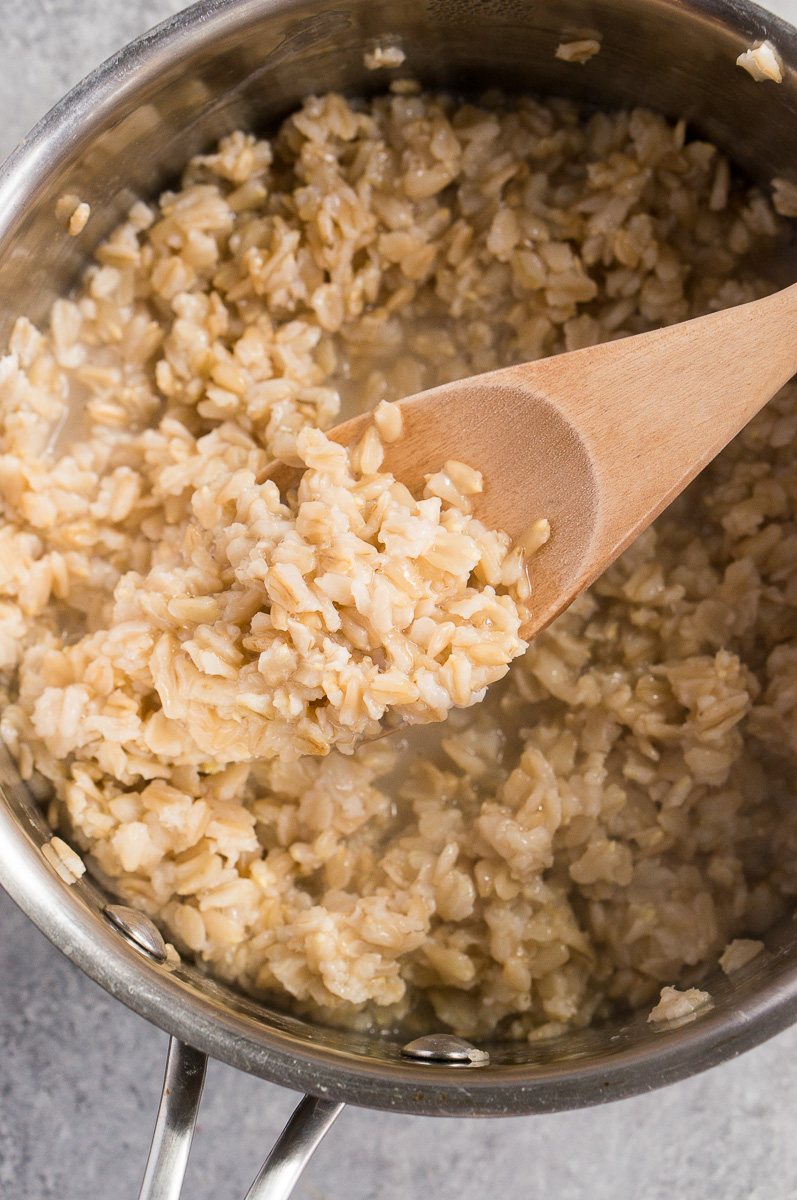 stirring oatmeal in a pot