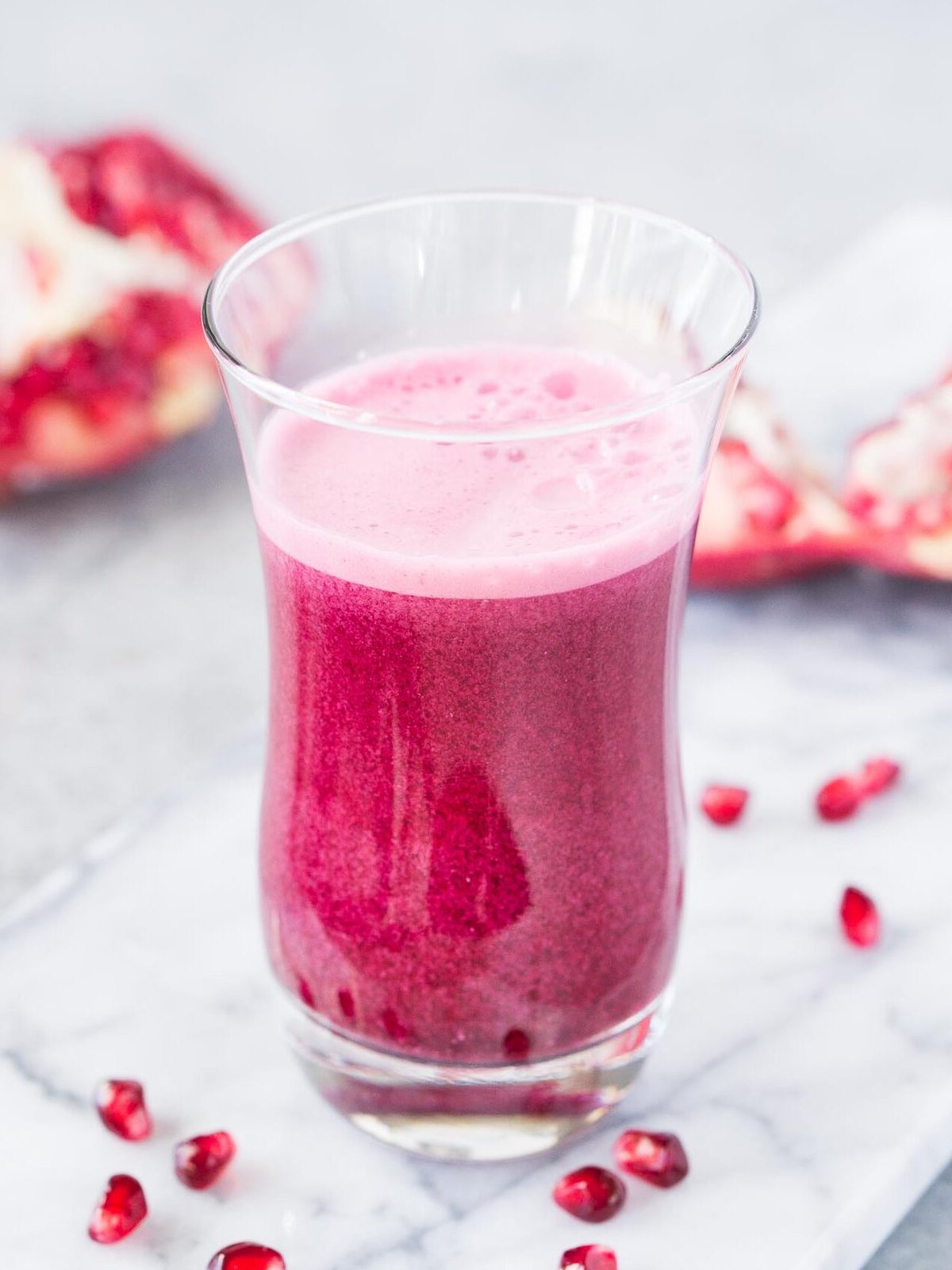 juiced pomegranate arils in a glass