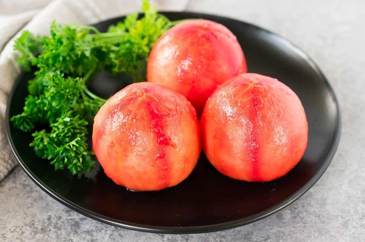 peeled tomatoes on a plate