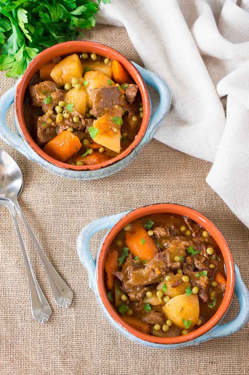 pressure cooker beef stew in two clay bowls