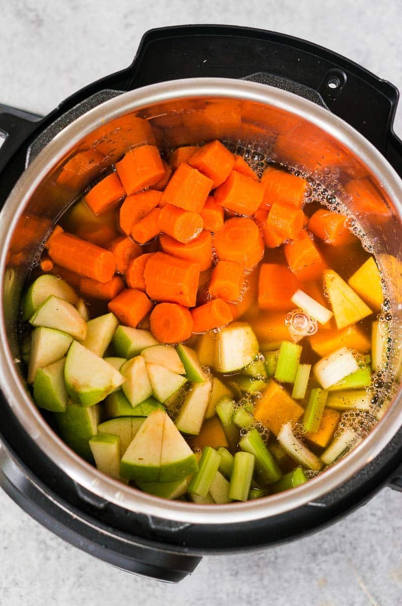 vegetables and stock in instant pot for butternut squash soup