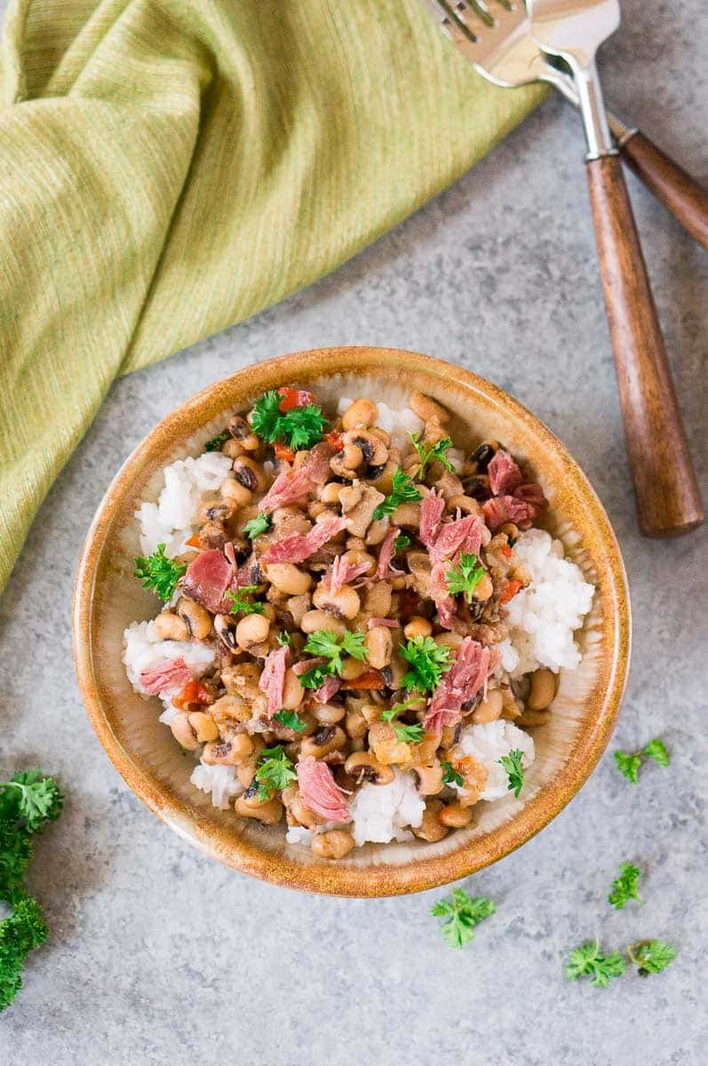 caroline peas and rice in a bowl next to a towel