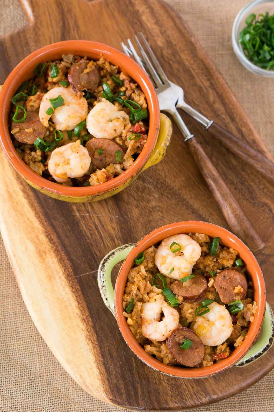 bowls with jambalaya on a board