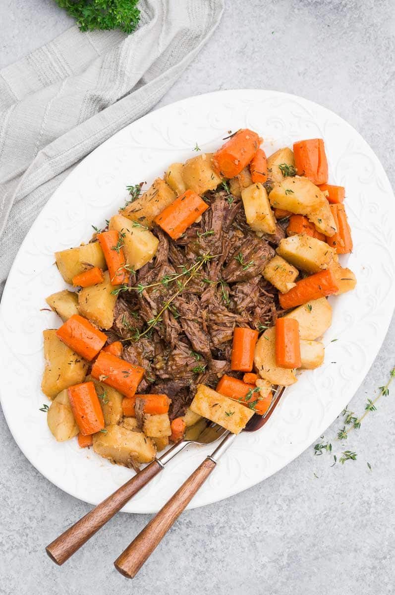 instant pot pot roast with vegetables on a serving platter