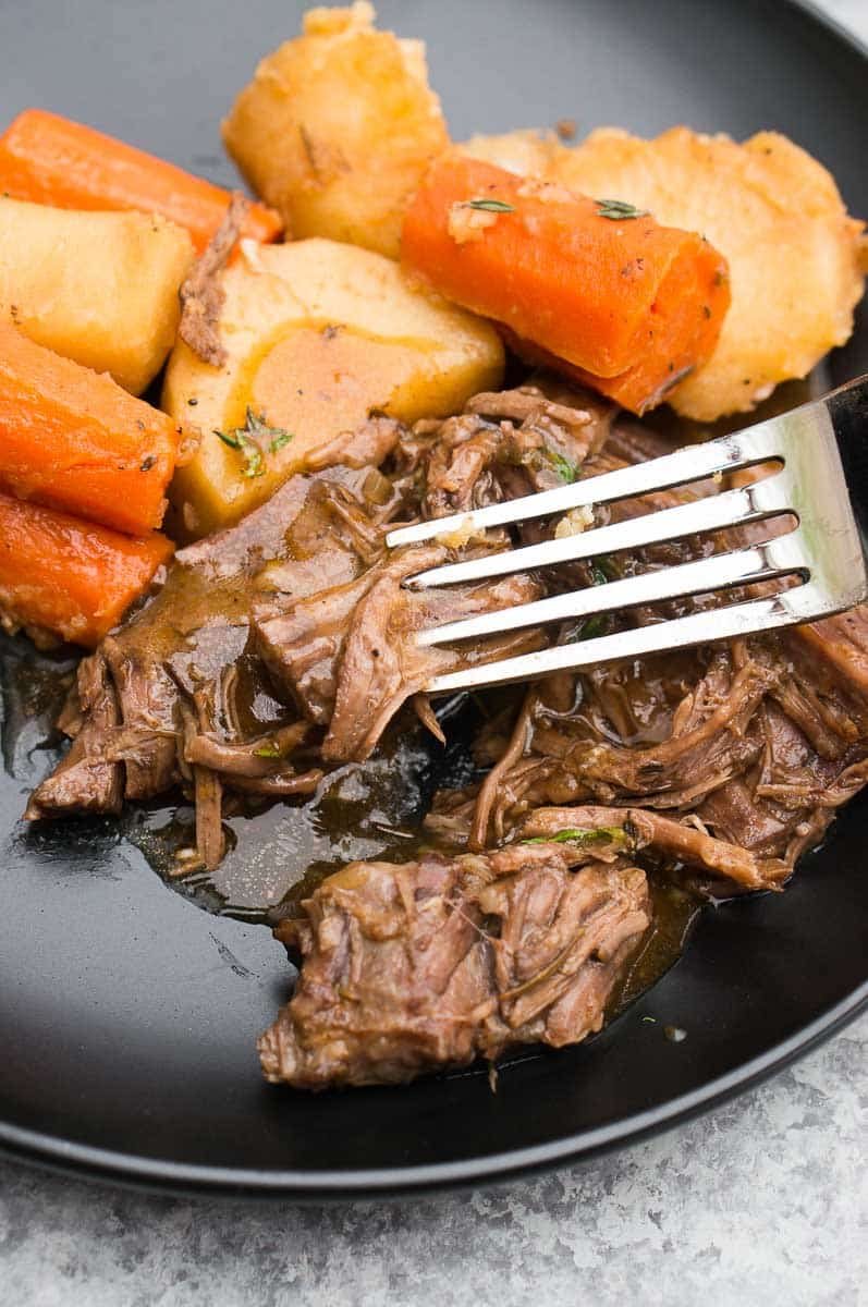 pressure cooker beef roast with potatoes and carrots on a plate