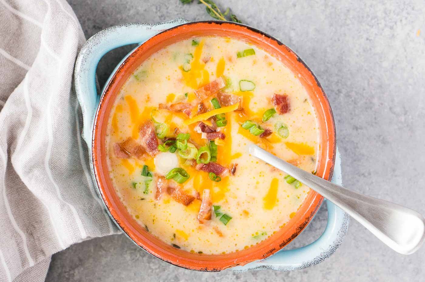 close up shot of loaded potato soup in a bowl