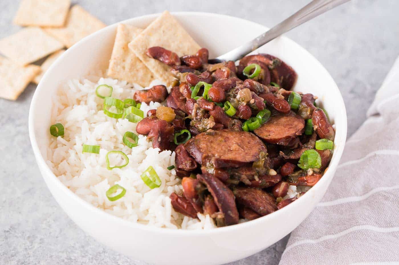 close up image of instant pot beans and rice with sausage in a bowl