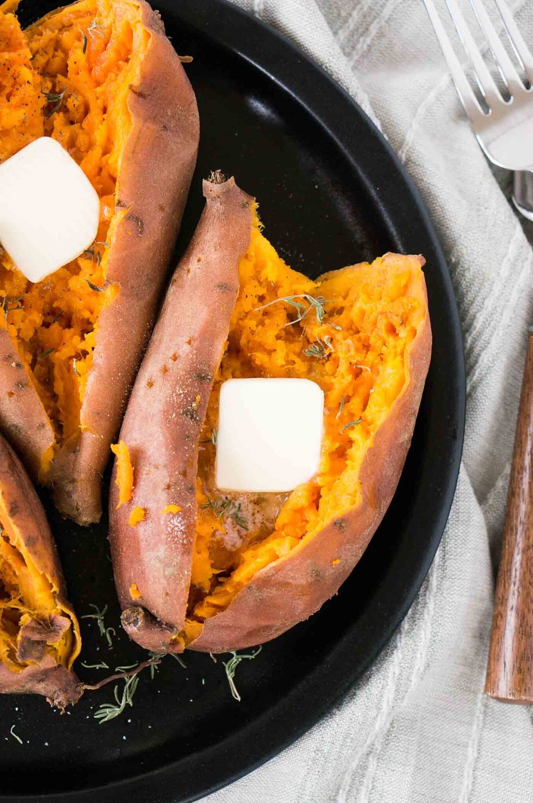 close up image of sweet potatoes cut in half on a plate