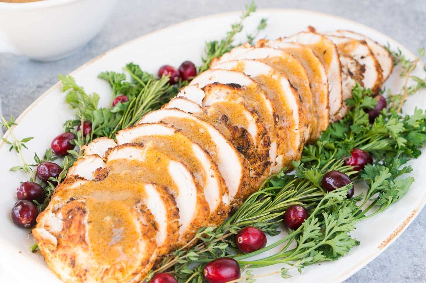 close up image of sliced turkey breast and gravy