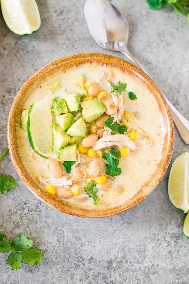 instant pot white chicken chili recipe in a bowl with avocado slices
