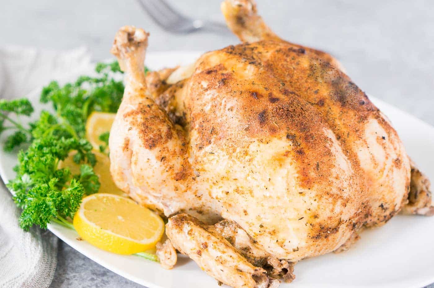 pressure cooked whole chicken on a platter
