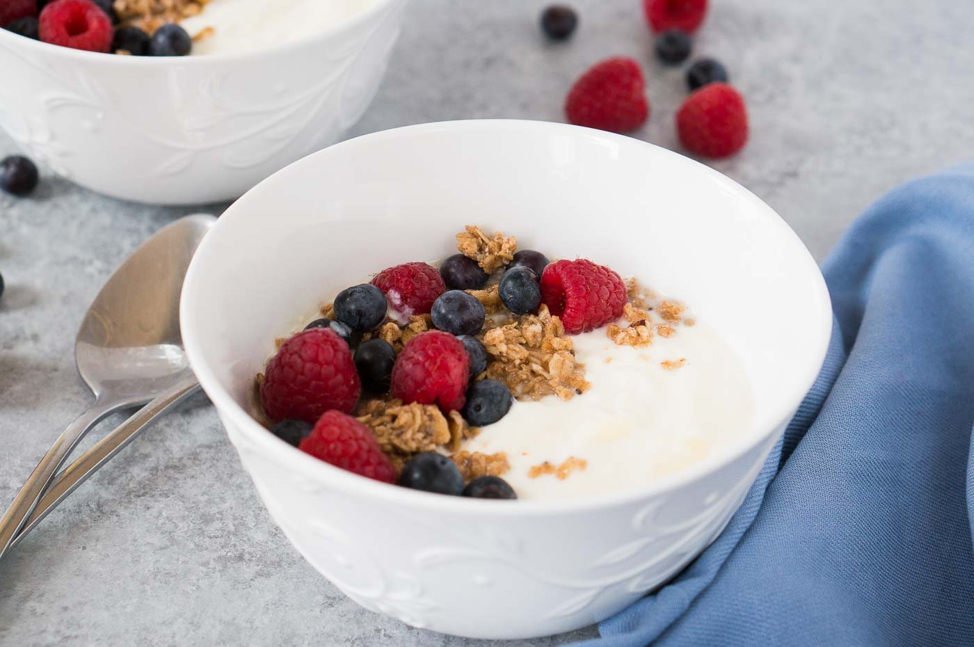 homemade instant pot yogurt in a bowl with granola and berries