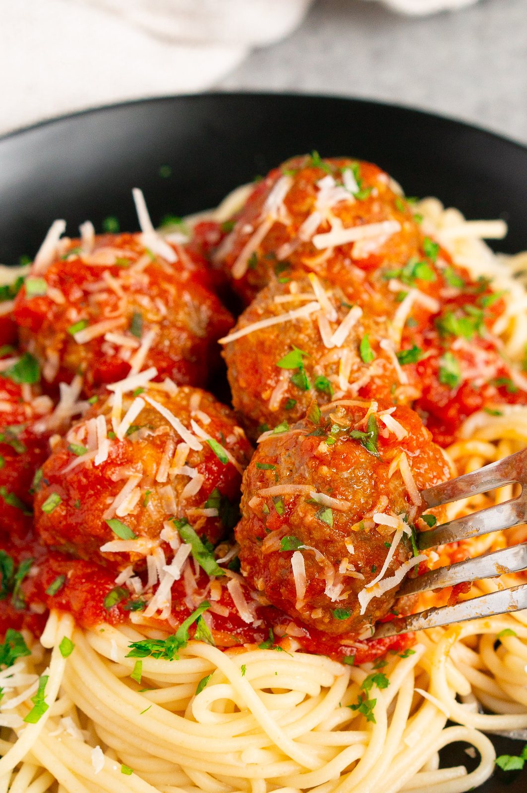 meatballs in marinara sauce over spaghetti