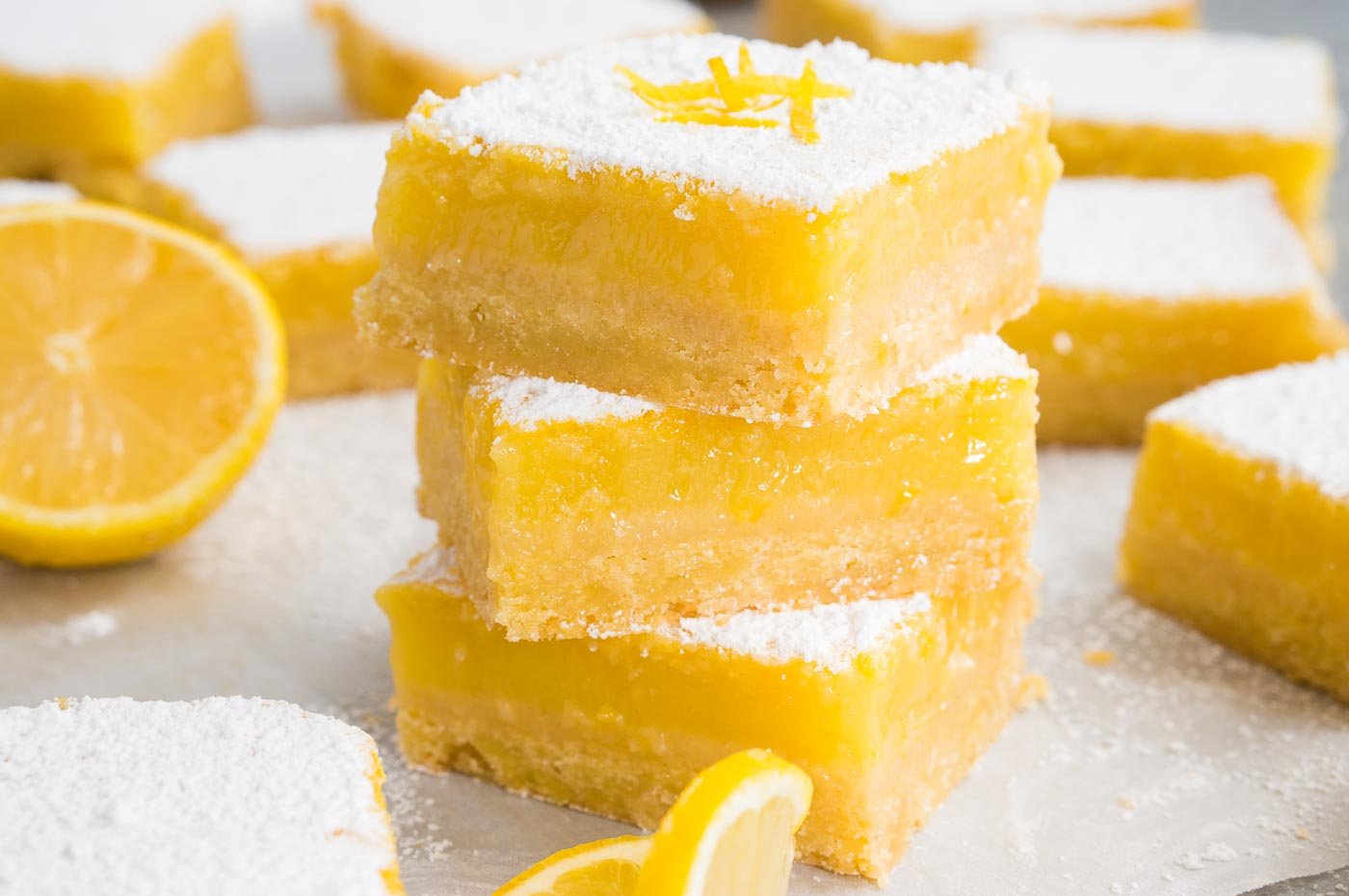 stacked lemon bars on board