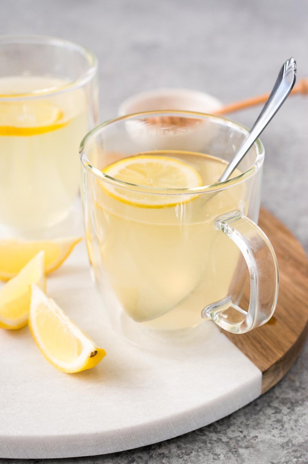lemon and honey tea in a glass cup