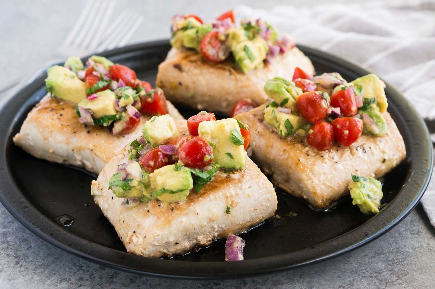 Mahi Mahi with salsa on a plate