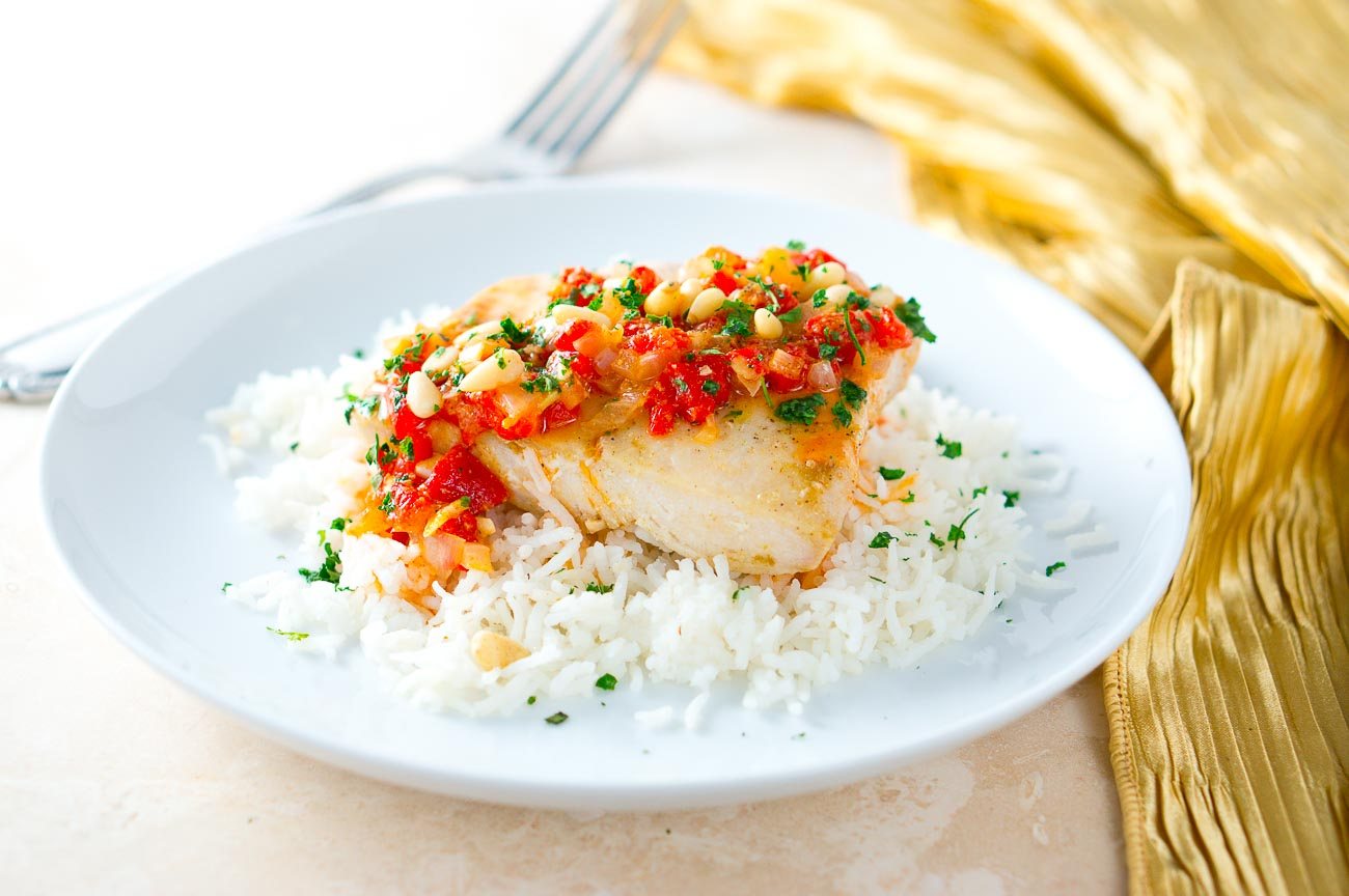 Mahi Mahi on a white plate topped with sauce