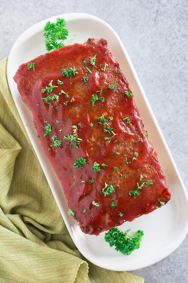 juicy homemade meatloaf with delicious ketchup glaze on a platter