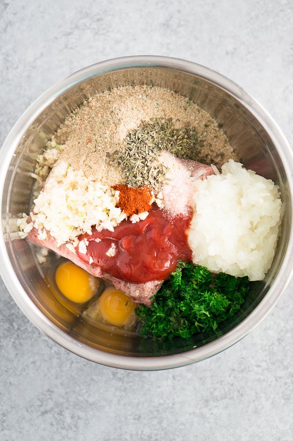 Ground beef meatloaf mixture with onion, garlic, and breadcrumbs