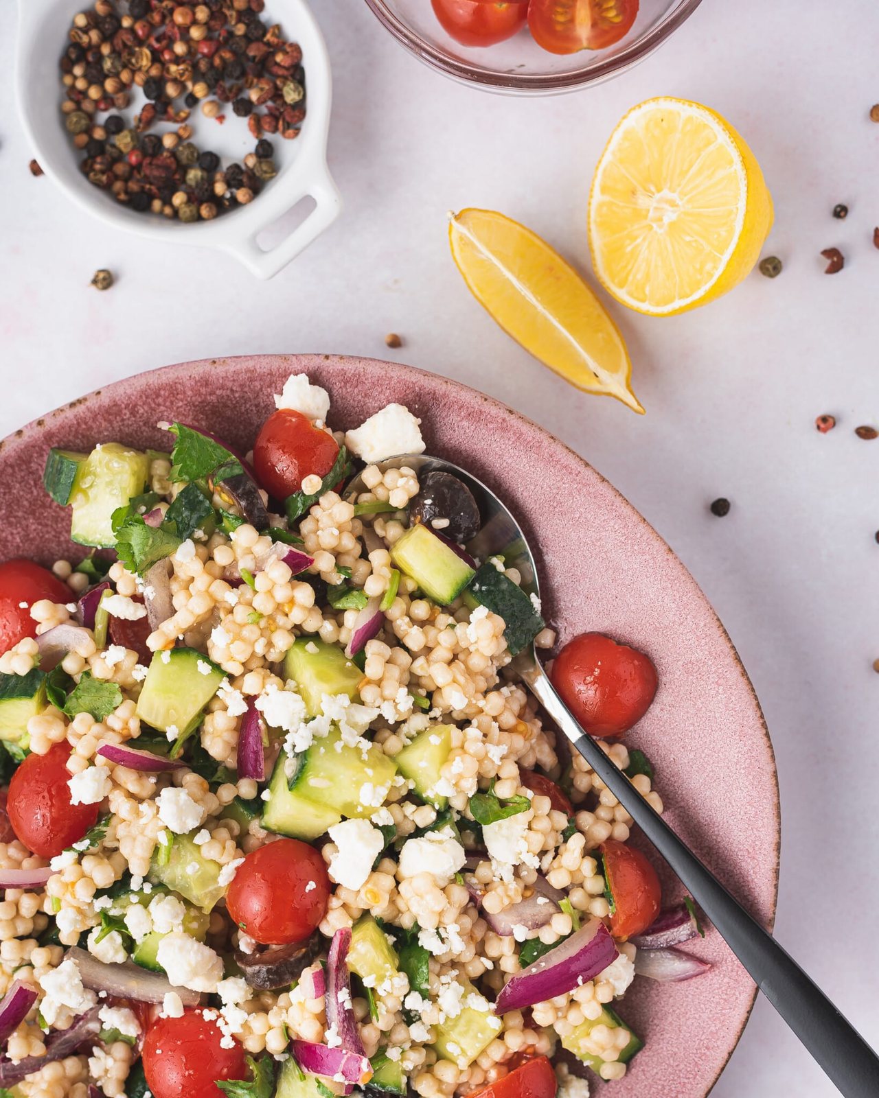 mediterranean pearl couscous made with veggies on a plate
