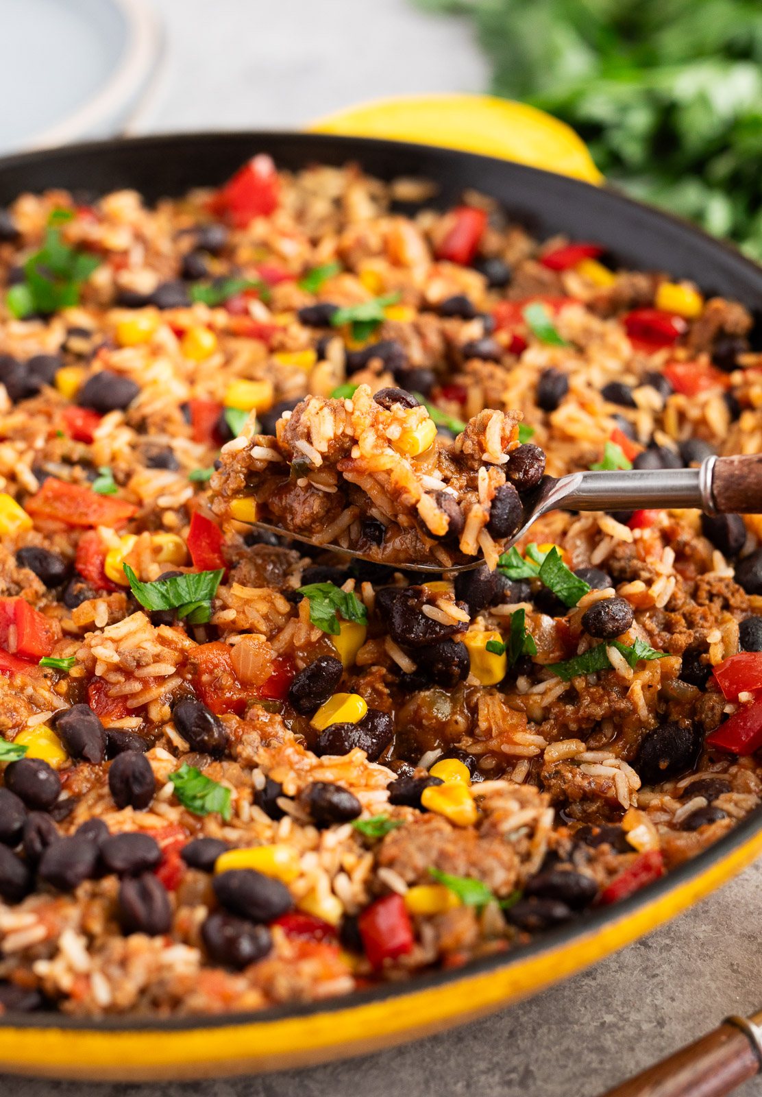 Tex Mex beef and rice with black beans and corn cooked in a skillet