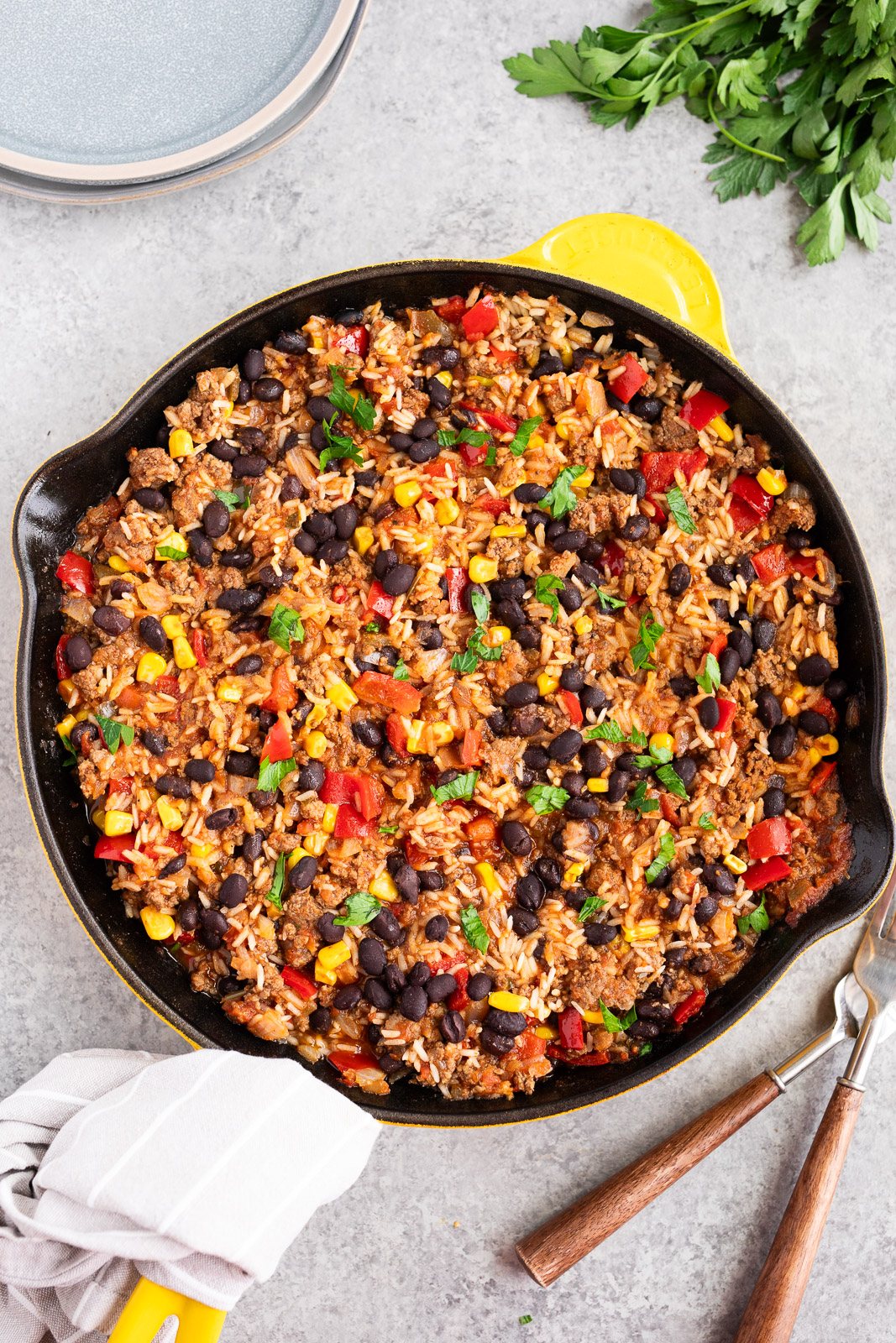 Easy ground beef rice skillet recipe with salsa, black beans, and corn