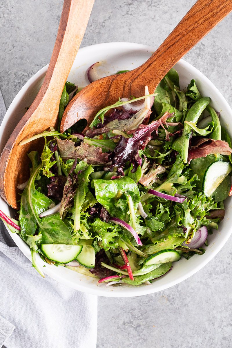 tossing salad to coat with dressing