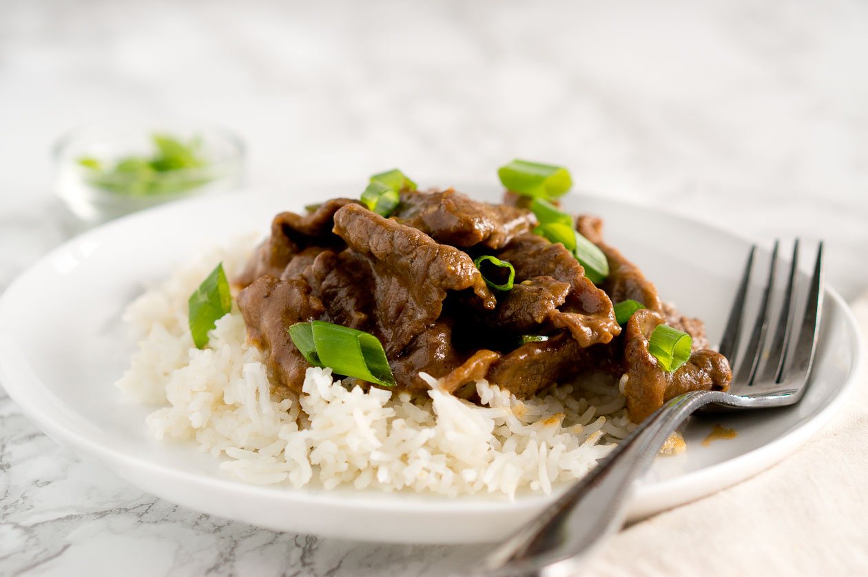 Mongolian beef garnished with green onions