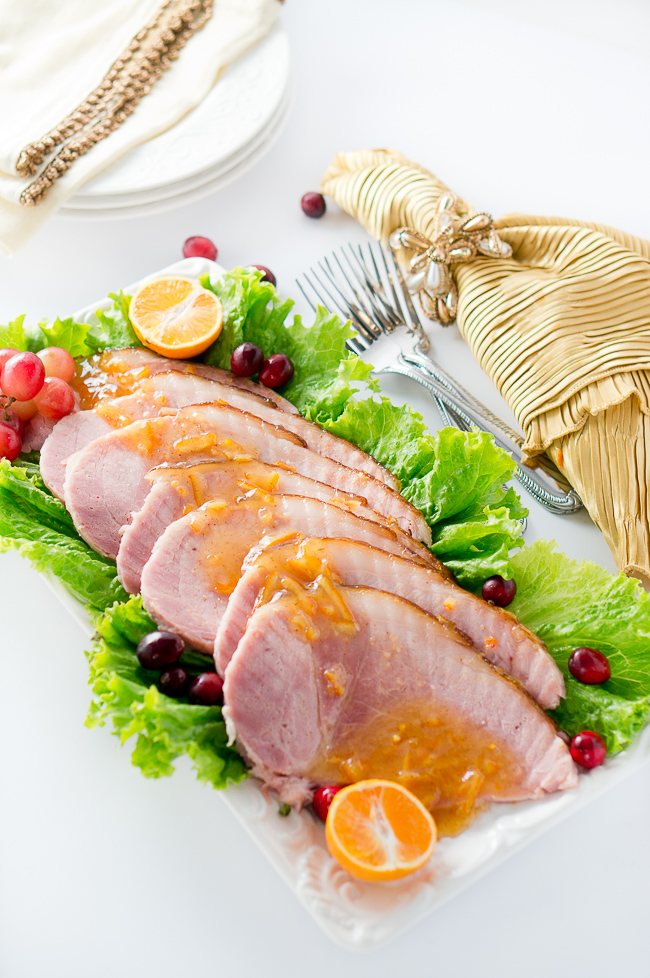 Orange Dijon Glazed Ham - Succulent spiral ham is brushed with a sweet and tangy orange dijon glaze, then roasted until perfection, creating a delicious caramelized outer layer.