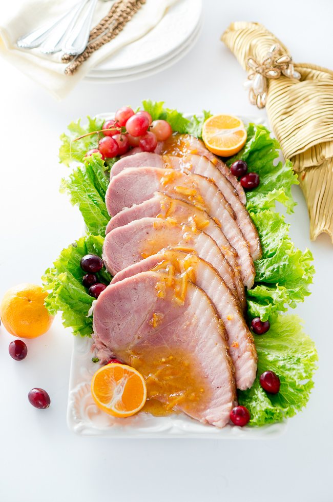 Orange Dijon Glazed Ham - Succulent spiral ham is brushed with a sweet and tangy orange dijon glaze, then roasted until perfection, creating a delicious caramelized outer layer.