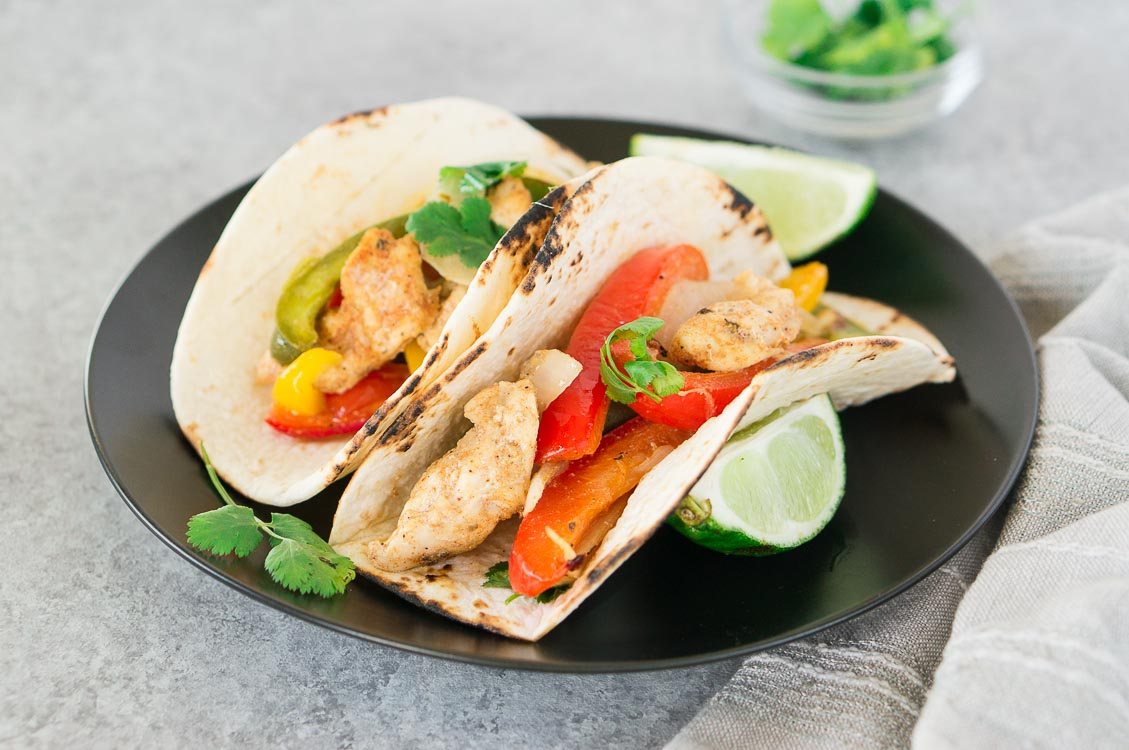 baked fajitas on tortilla on a plate