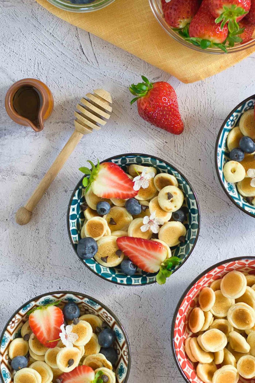shot from above of pancake cereal in a bowl with toppings