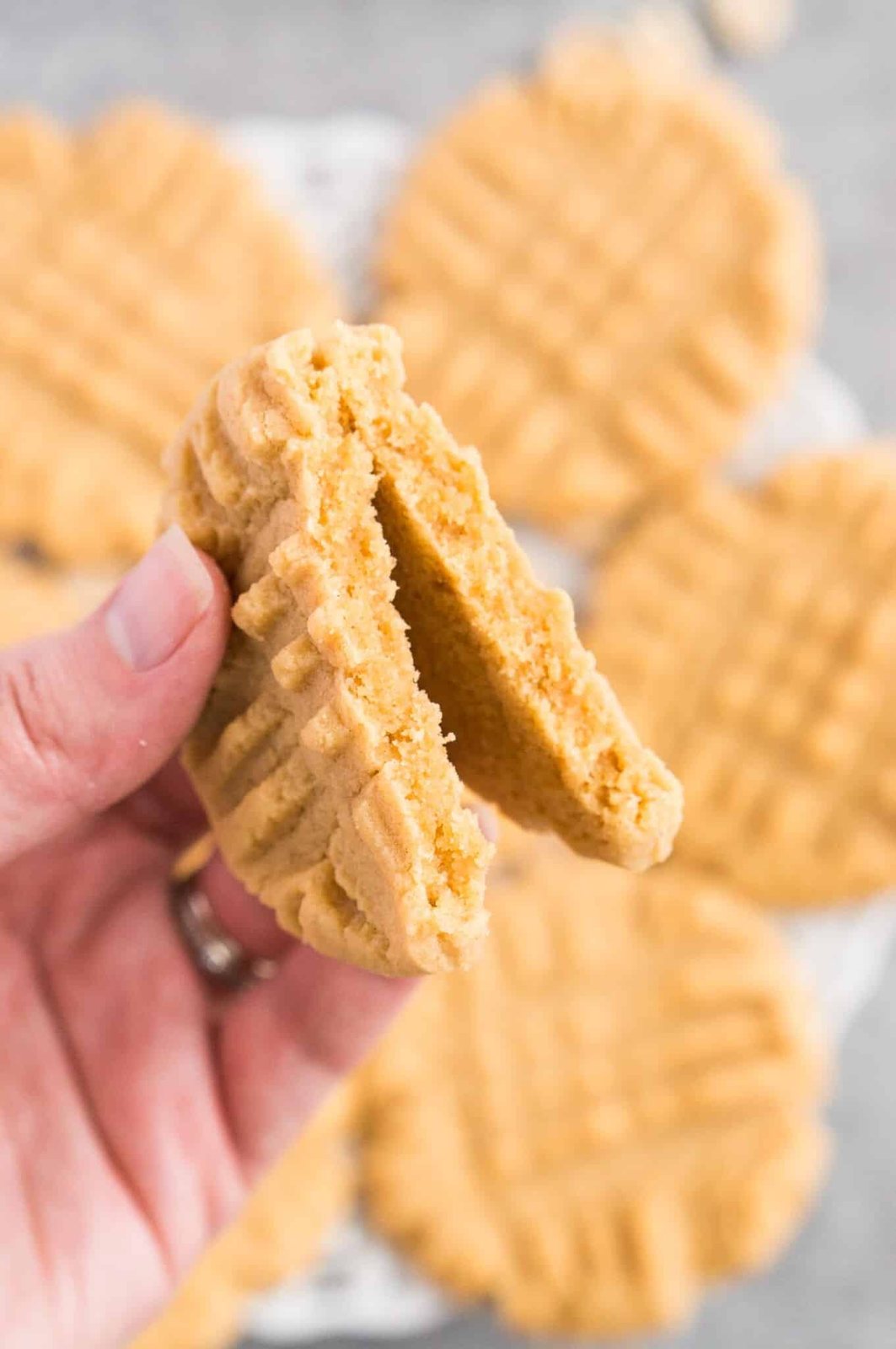 close up image of holding a split cookie