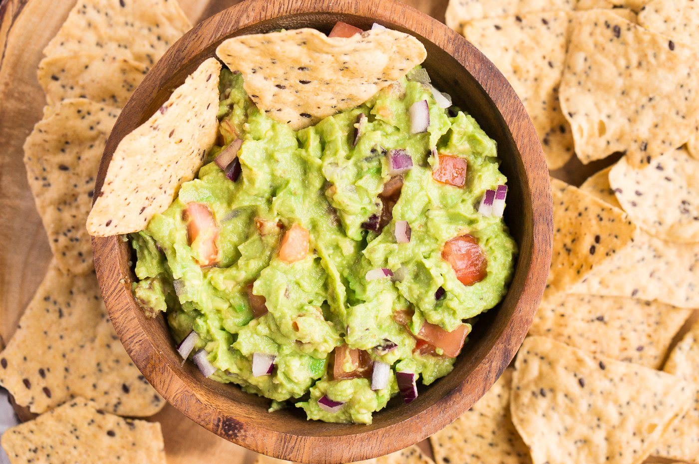 close up of guacamole recipe in a bowl with chips