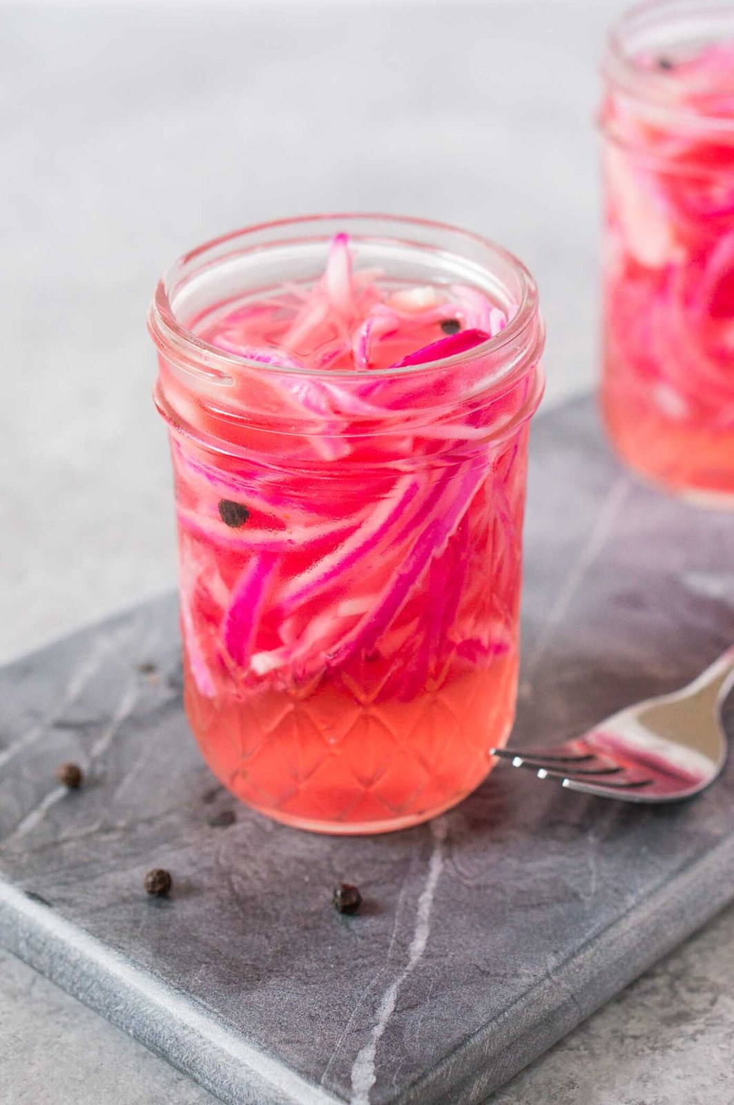 pickled red onions in a jar