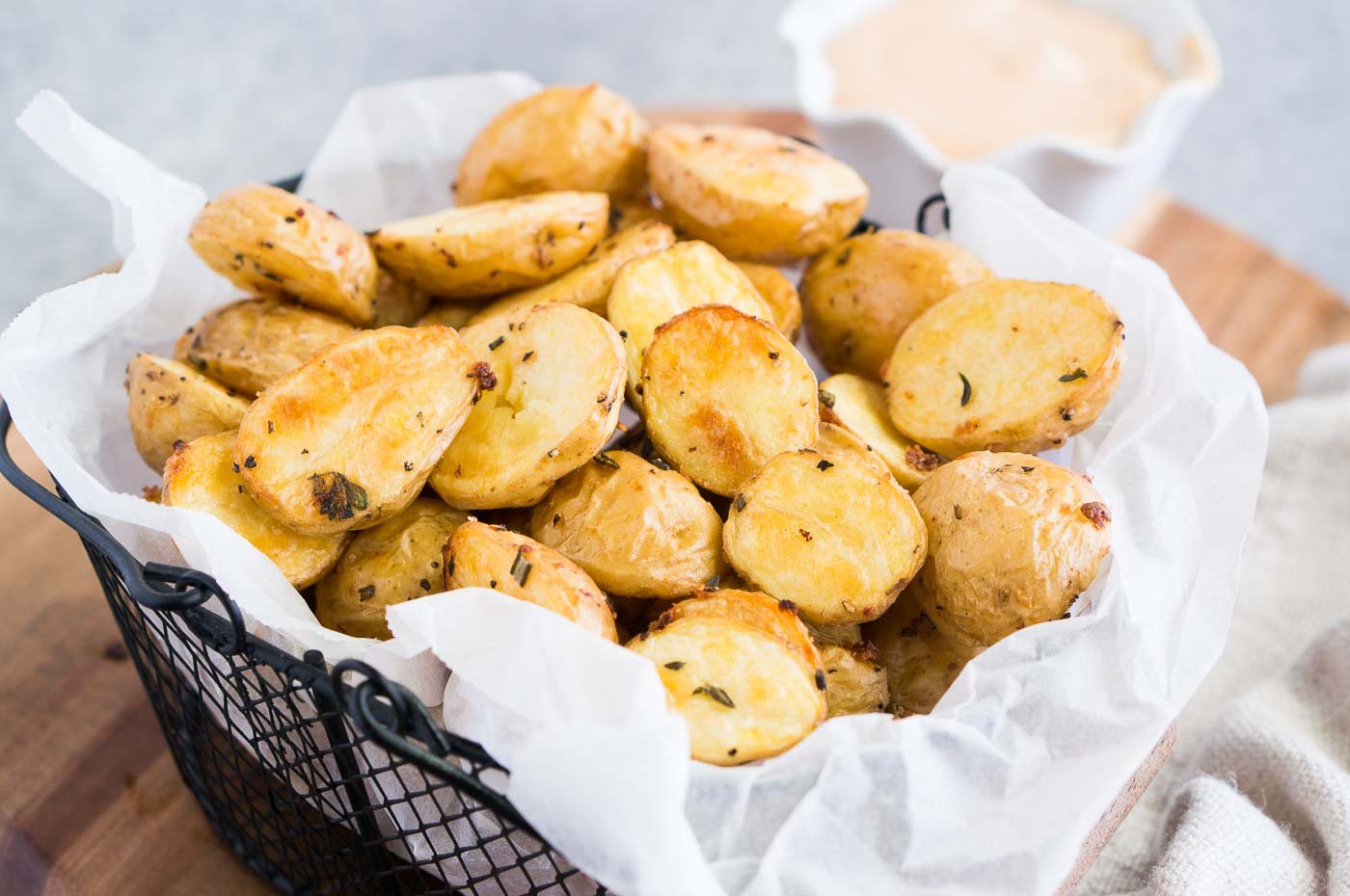 close up image of roasted baby potatoes in a basket