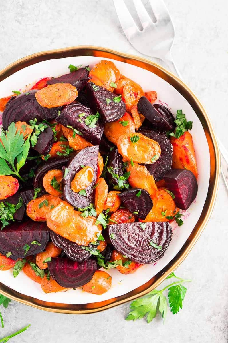 roasted beets and carrots - thanksgiving side dish served in a white bowl