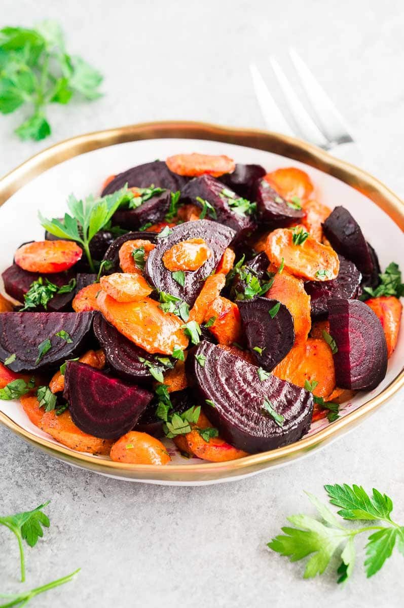 carrots and beets roasted and served in a bowl