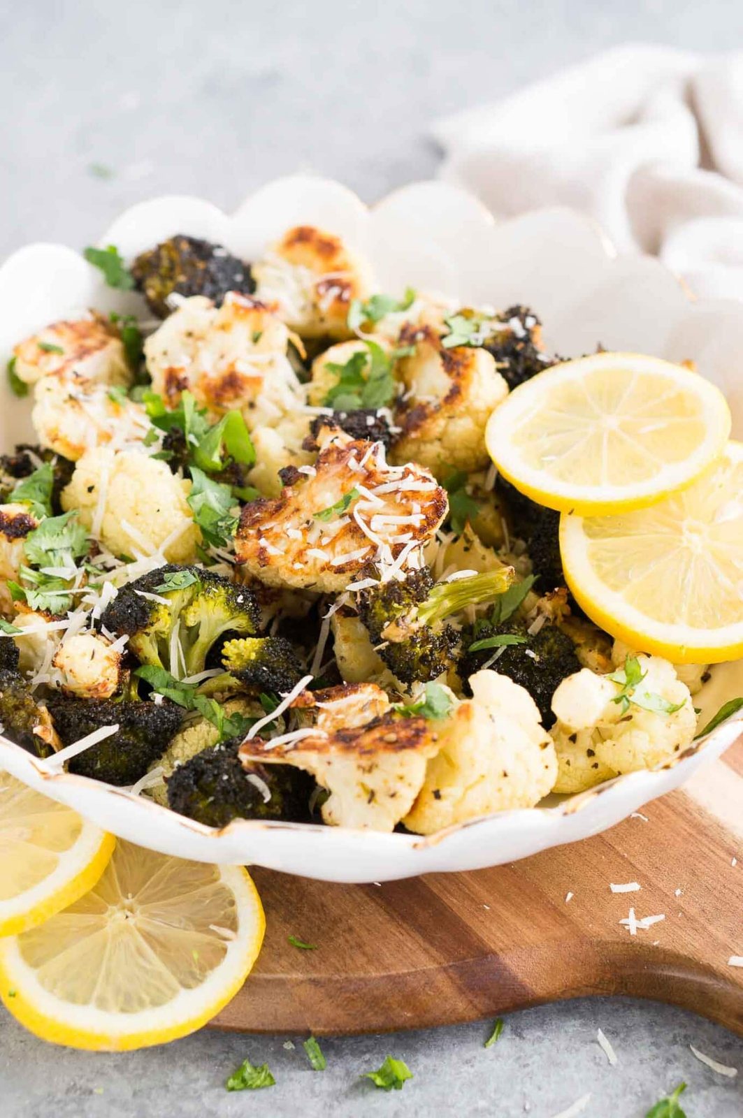 oven roasted broccoli and cauliflower in a white bowl