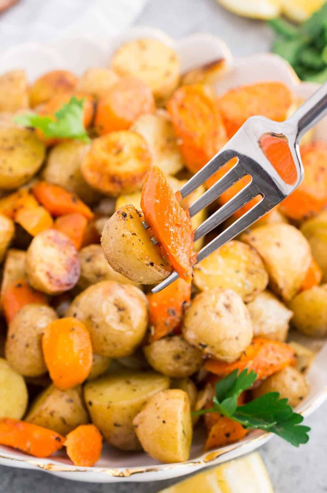 potato and carrot on a fork