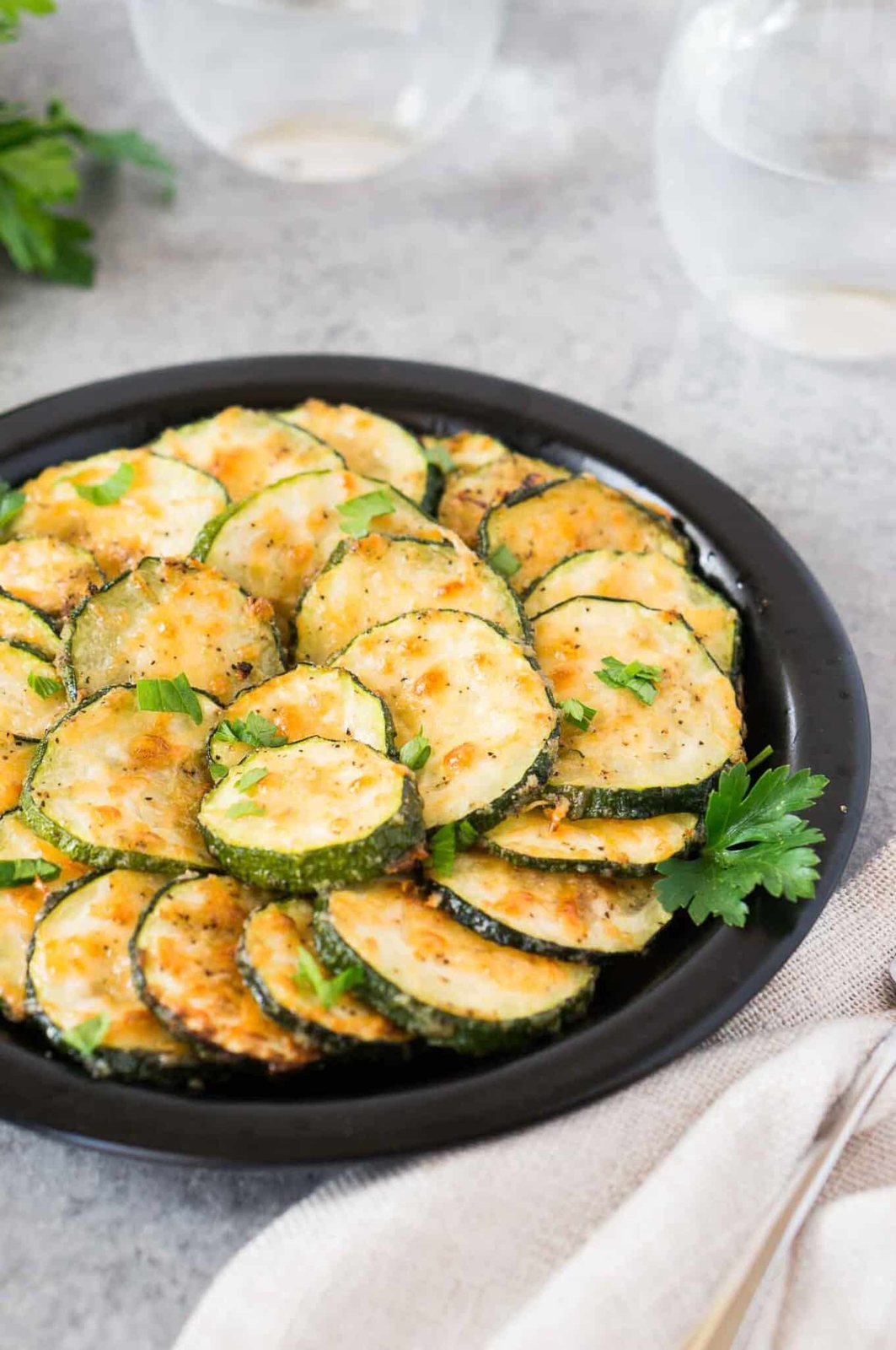 garlic parmesan zucchini rounds on a plate