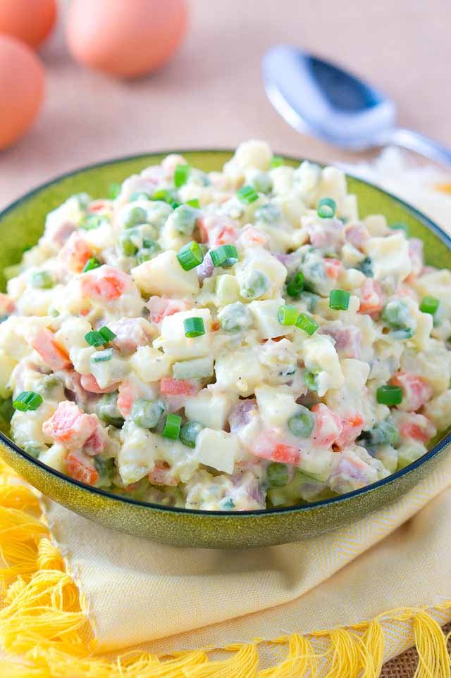 Russian Salad Olivier served in a green bowl