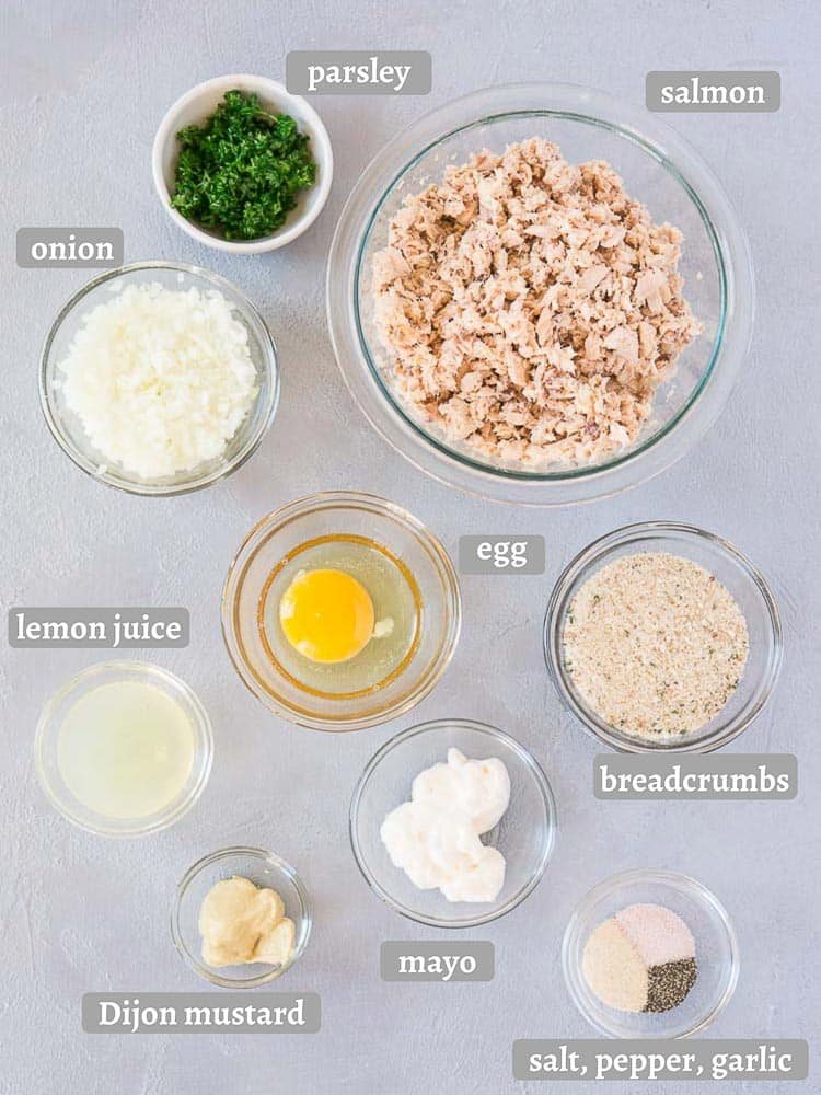 salmon patties ingredients on a gray board