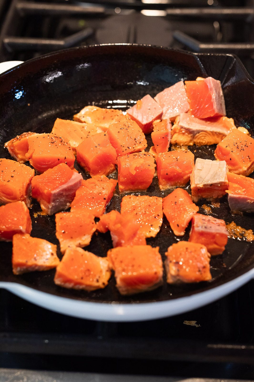 cooking salmon bites in a skillet