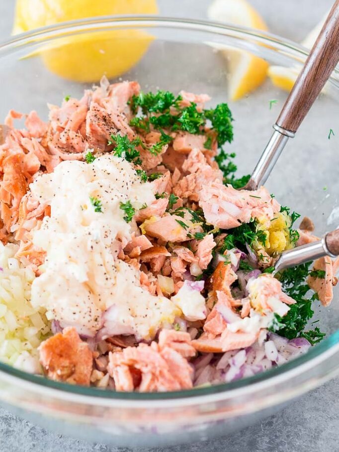 cooked salmon and mayo and aromatics in a bowl