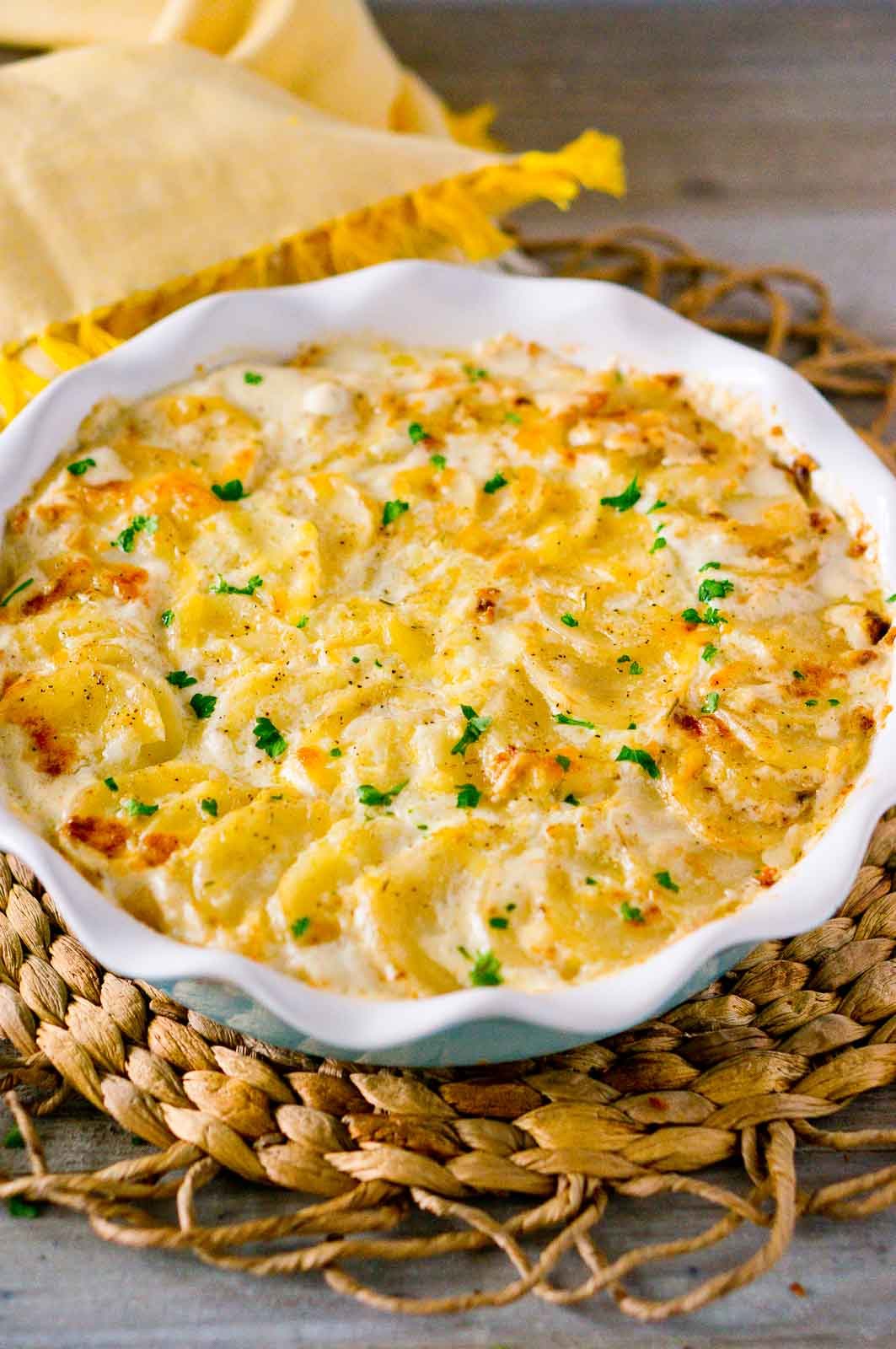 Scalloped Potatoes garnished with fresh herbs