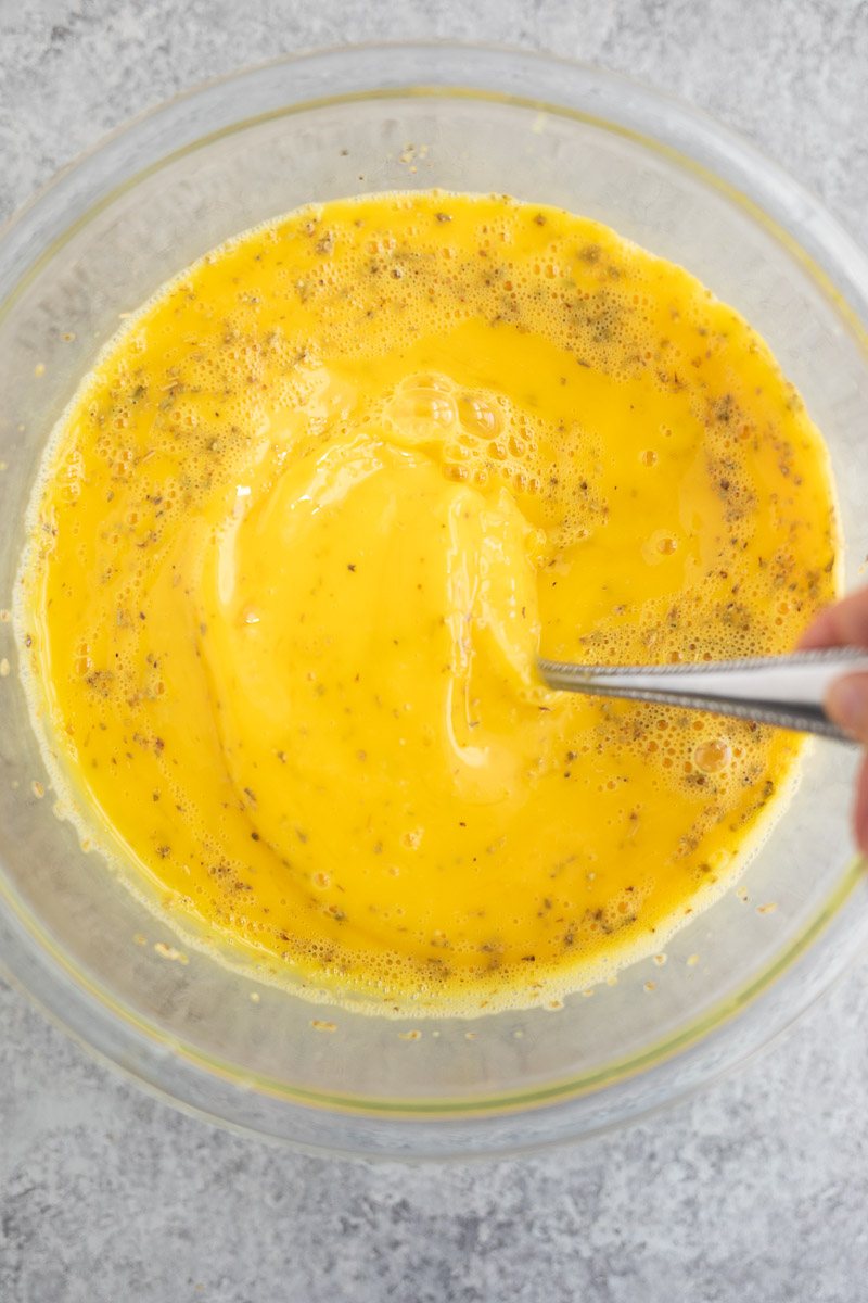 whisking eggs in a bowl